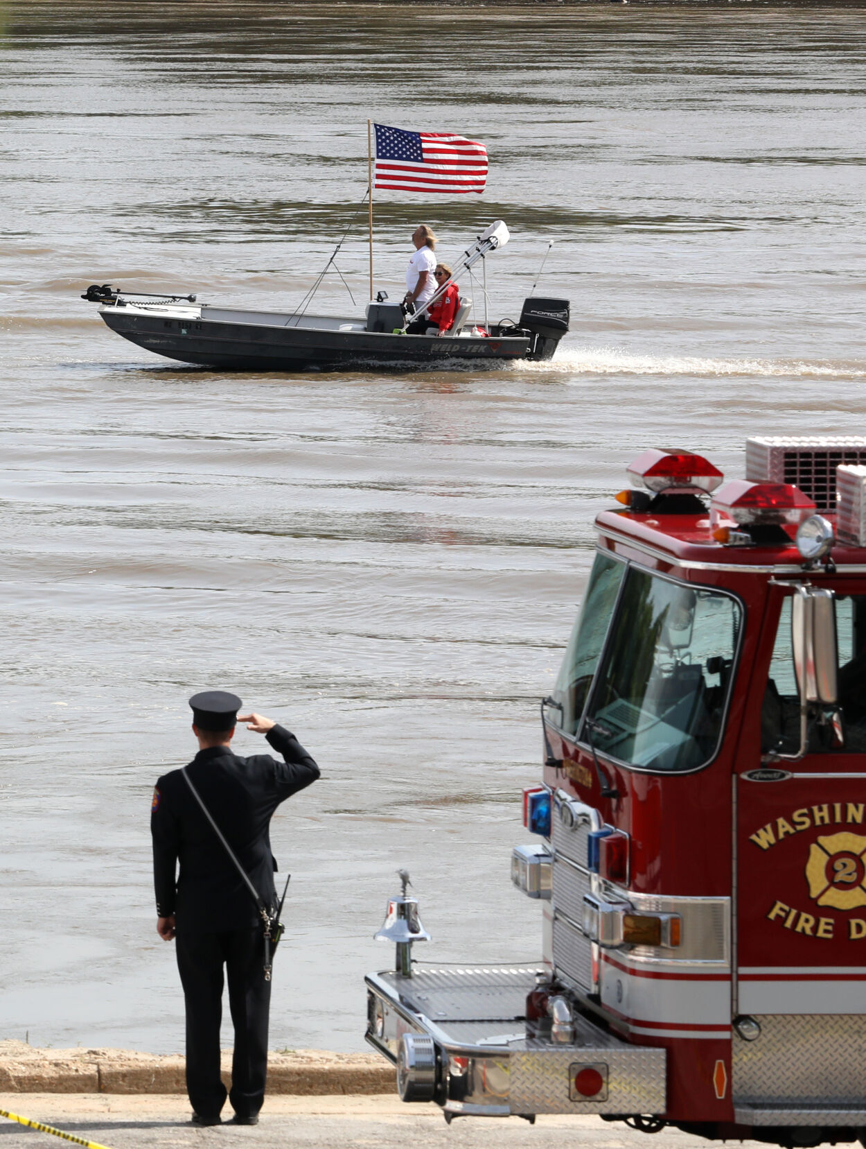 A firefighter stands at attention